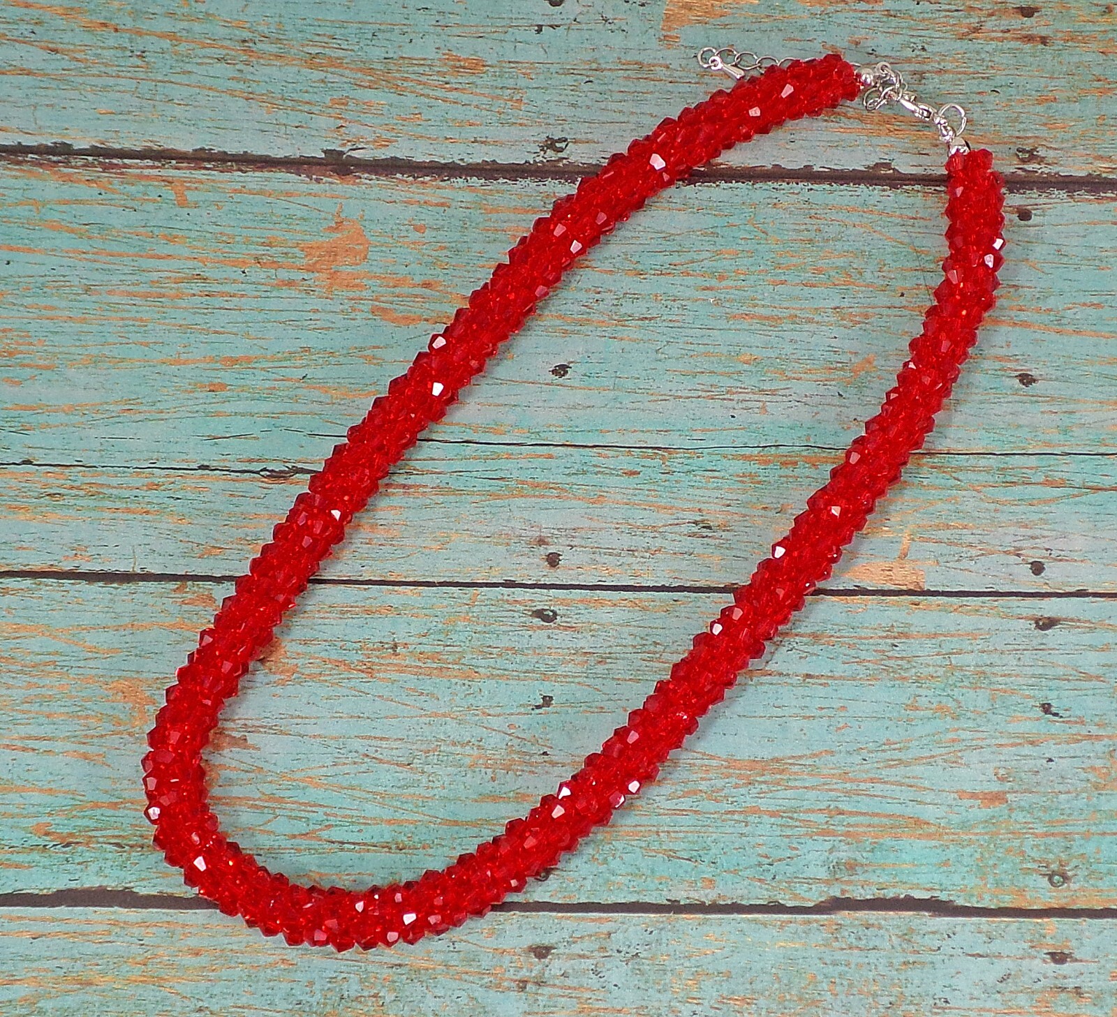 Red glass beaded necklace in a sparkling thick cluster beaded rope design New
