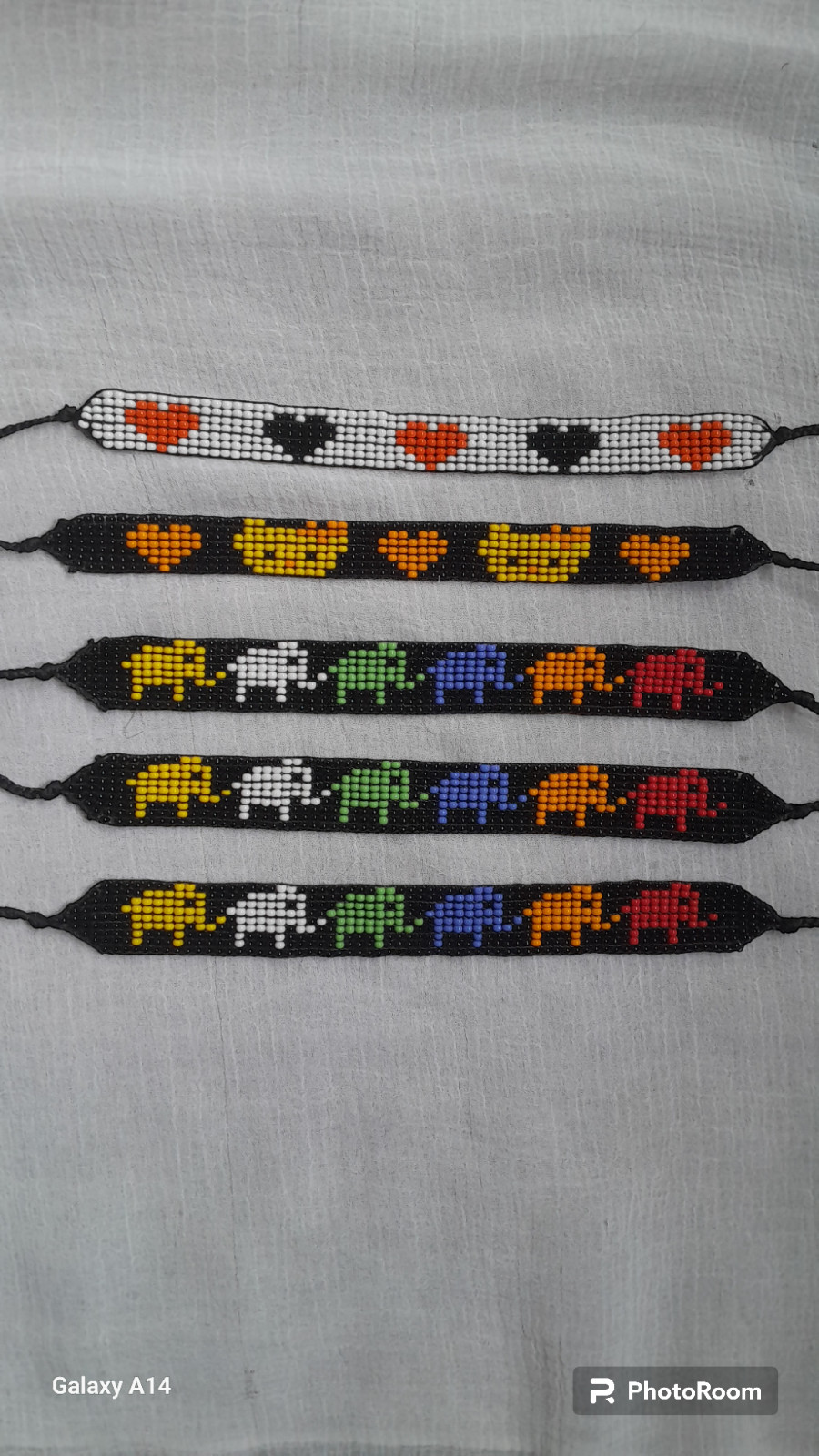 42 BEADED HANDMADE BRACELETS AND 28 PAIRS OF BEADED HANDMADE EARRINGS(LOT OF 70)