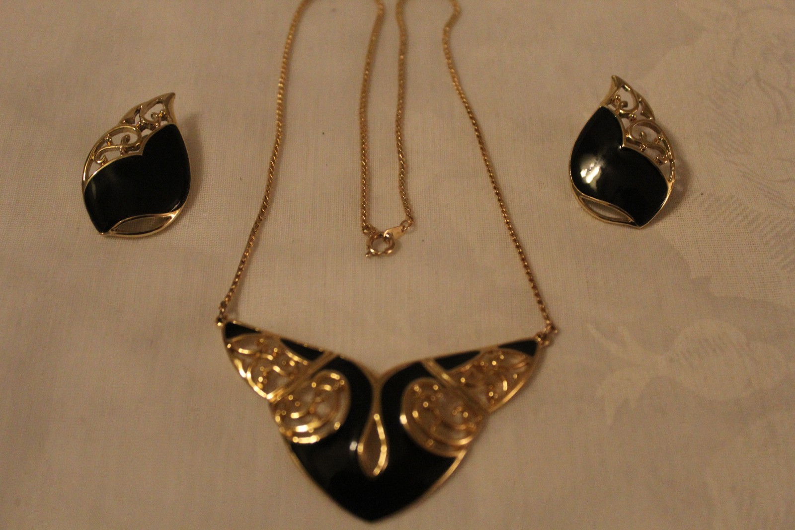 Filligree style necklace 17in and earrings. Gold plated with black emerald inlay