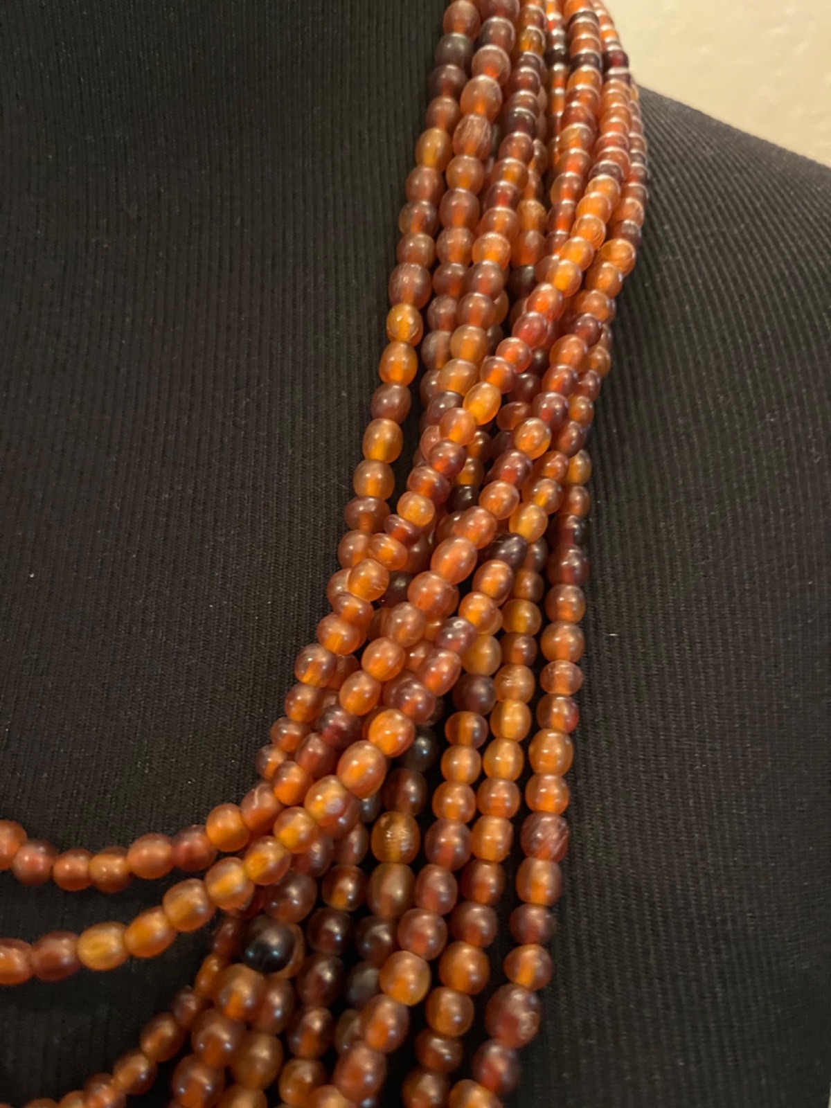 Multilayer warm brown draped necklace possibly acrylic brown clasp