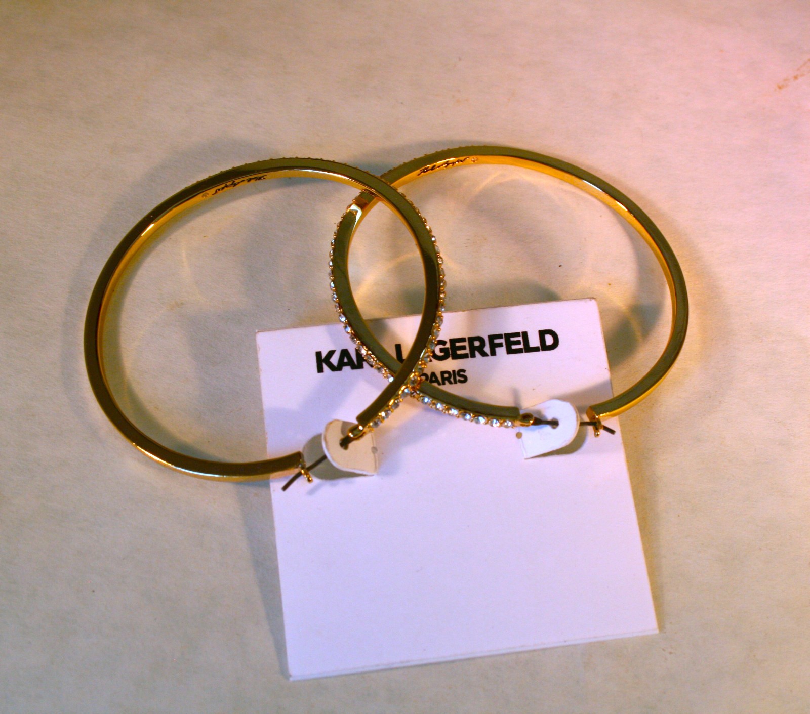 Karl Lagerfeld Paris gold tone Pave crystal edged Hoop Earrings 2 1/2″