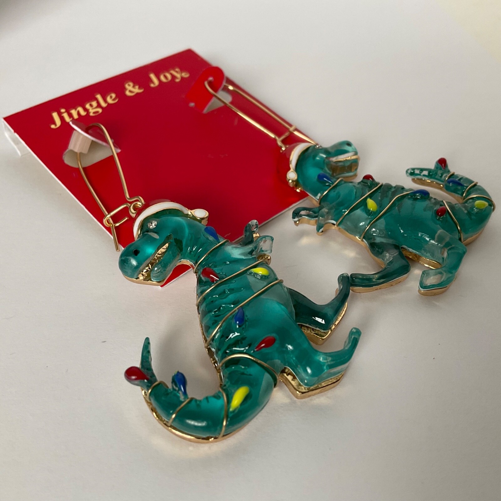 T-Rex Christmas Dinosaur Earrings Wearing Christmas Lights & Santa Hat