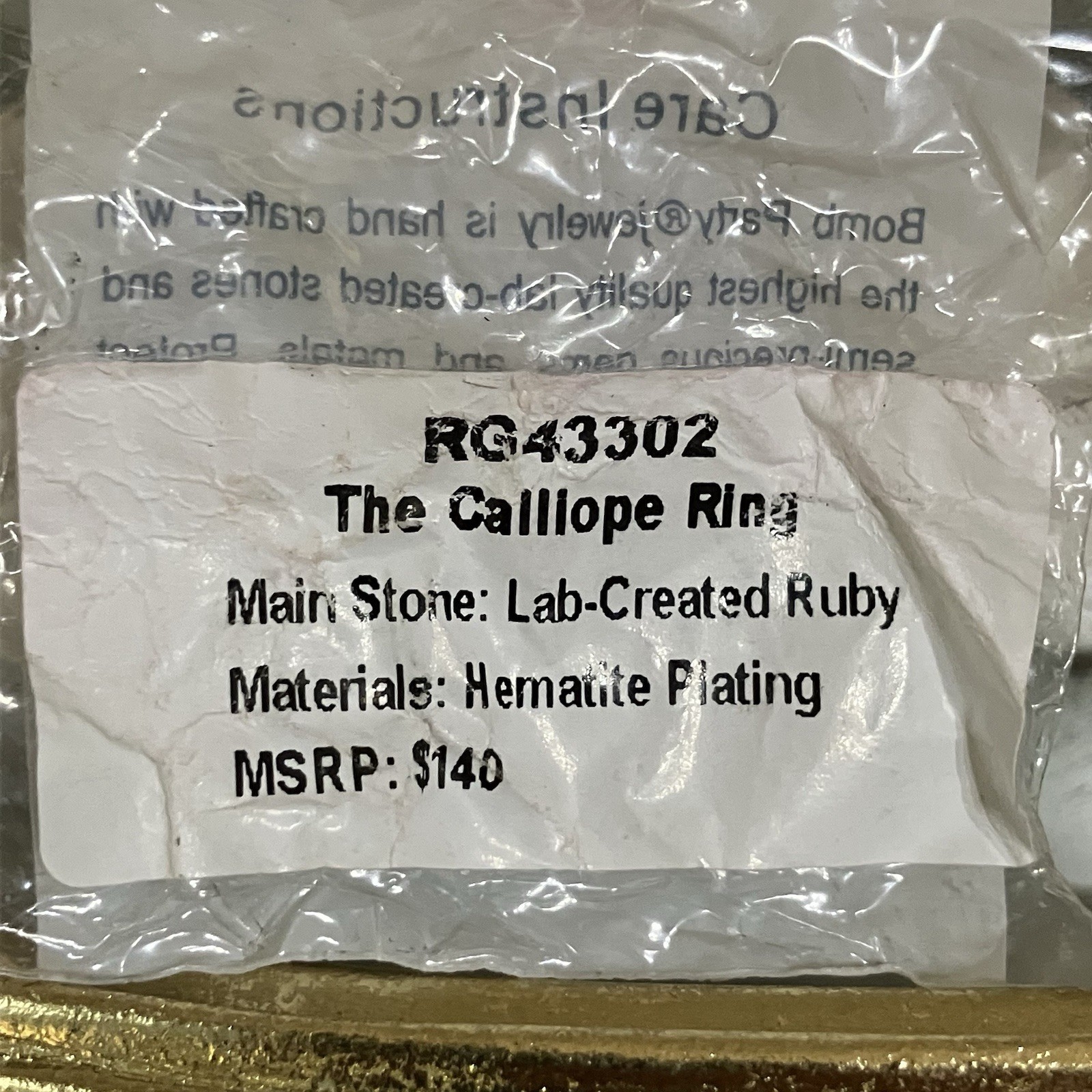 Bomb Party “The Calliope Ring” Lab Ruby Hematite Plating July 2026 RG43302 Sz 9