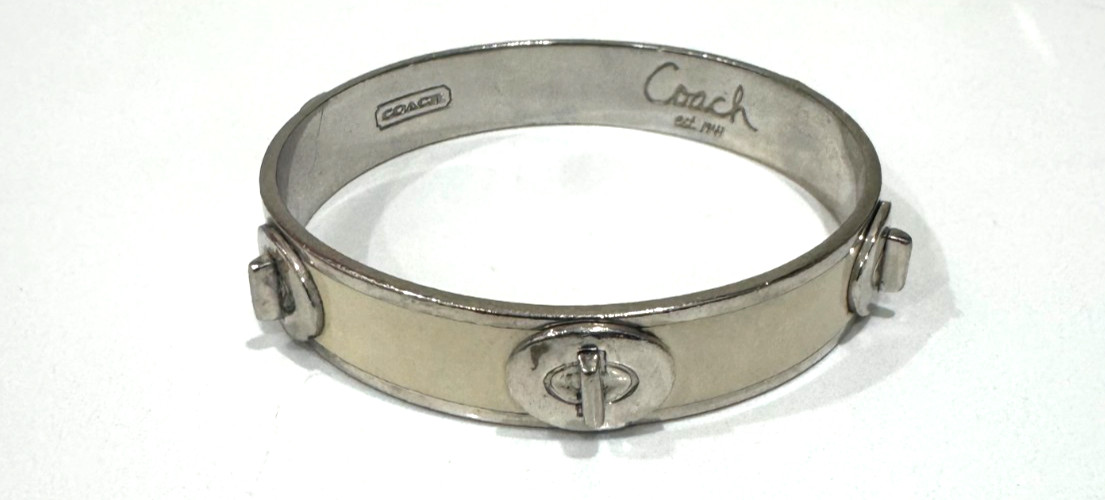 Coach Signature Silver / Cream Accent Tone Bangle Bracelet
