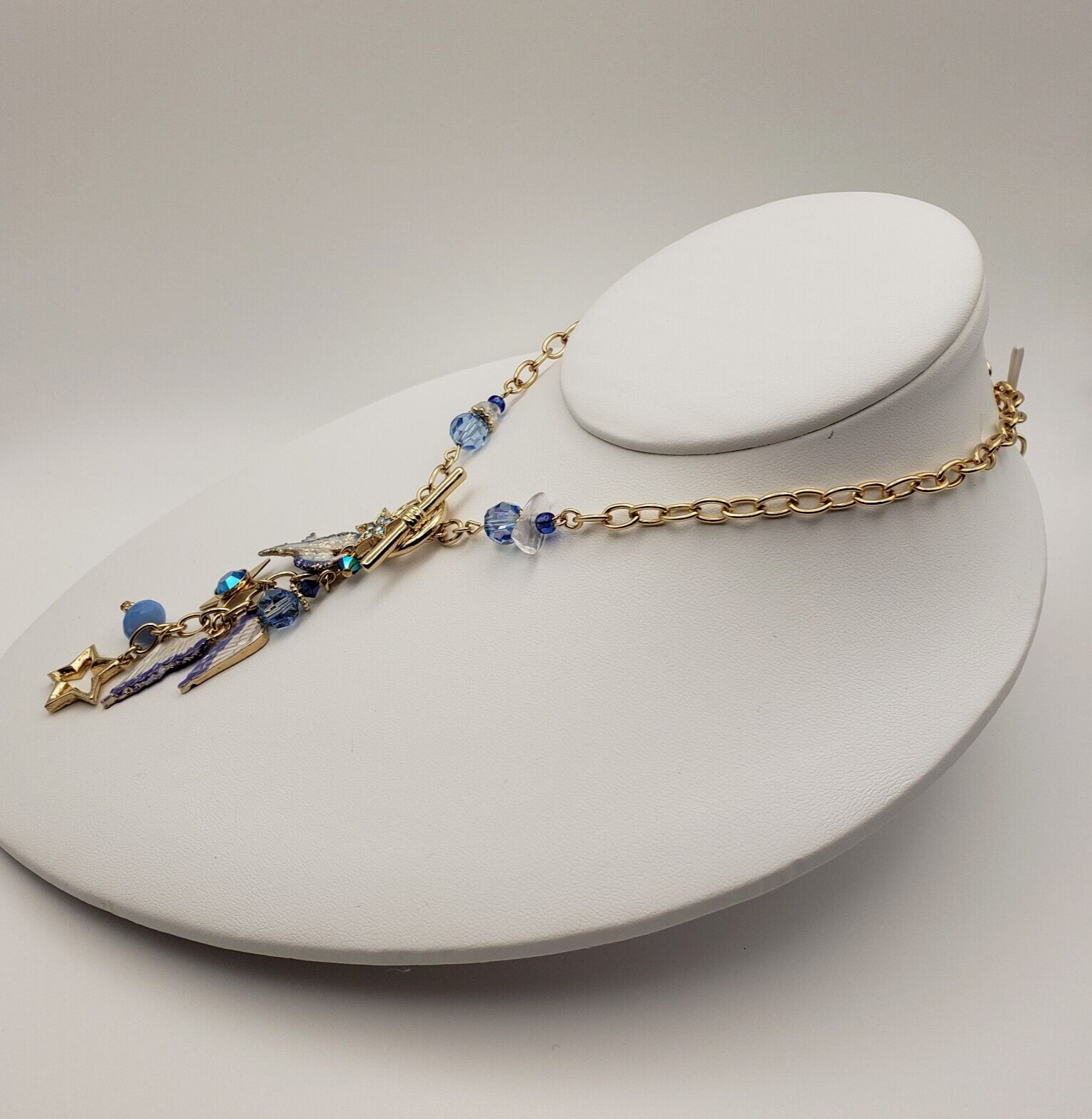 Kirks Folly Forever Angel Wings Charm Necklace Gold Tone 17in Long Blue Crystals