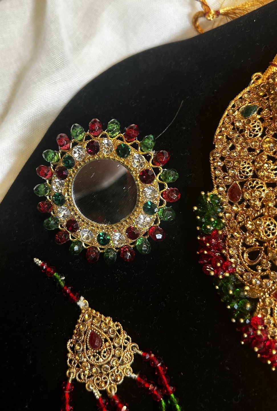 Gold Jewelry Set with Red and Green Details