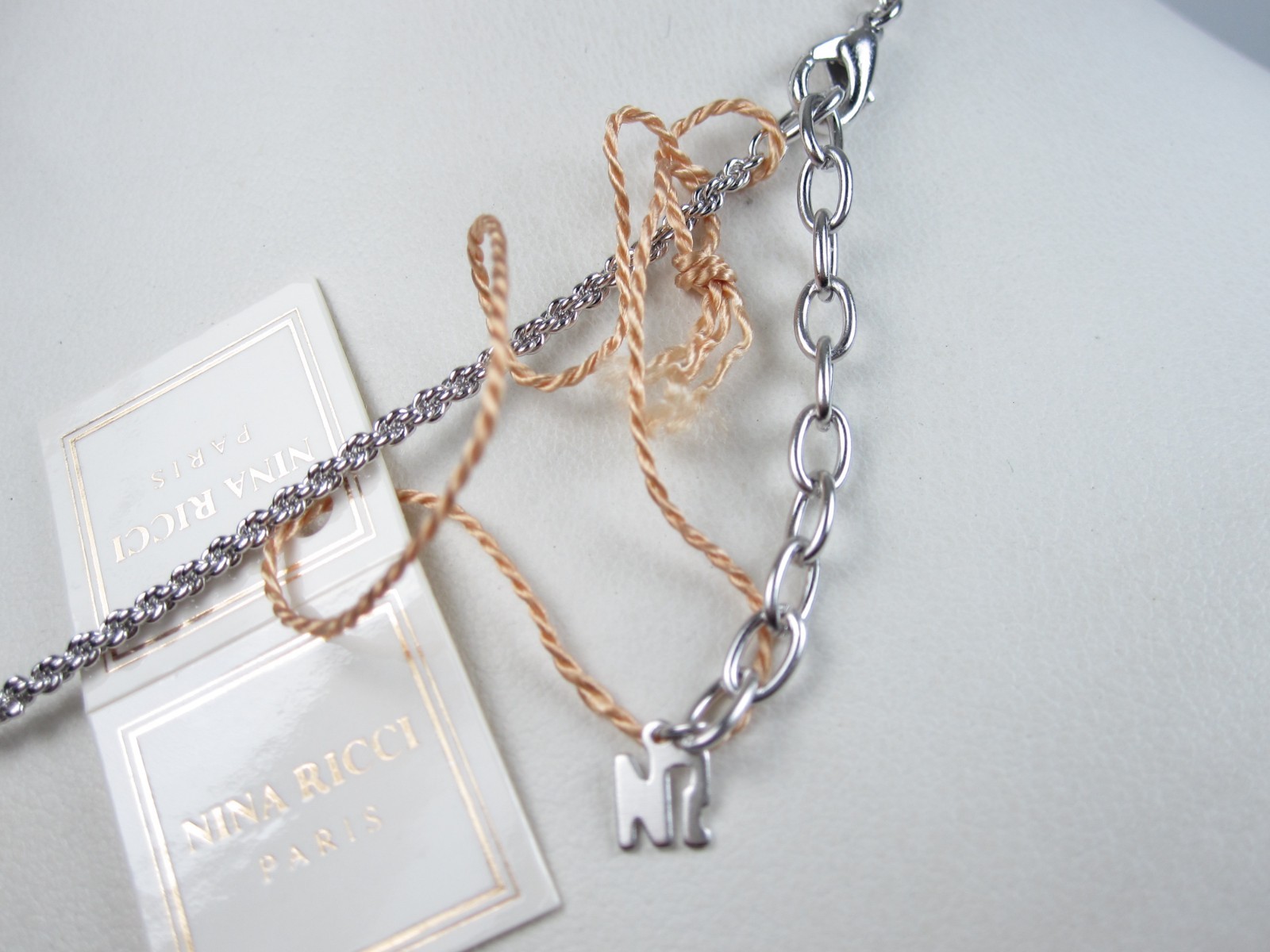 Nina Ricci Rhodium Plated Pendant 16-18″ – 9561