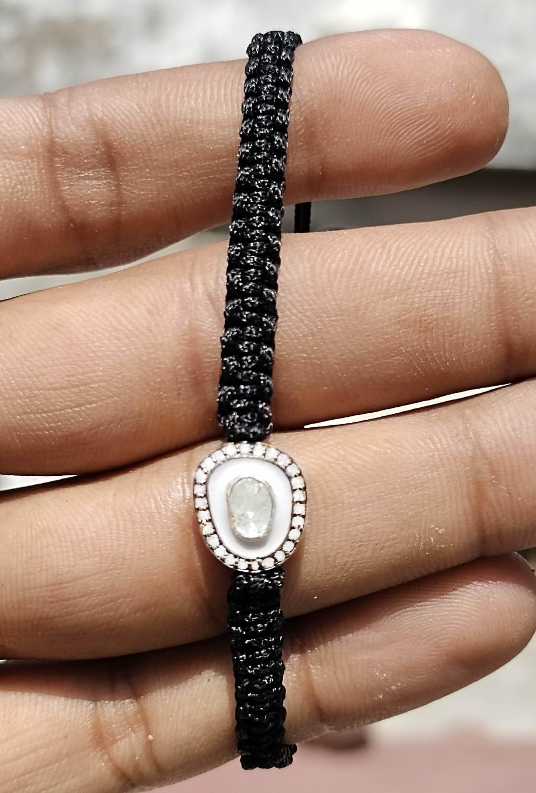 Natural Diamond White Enamel And Diamond Polki Adjustable Black Thread Bracelet.