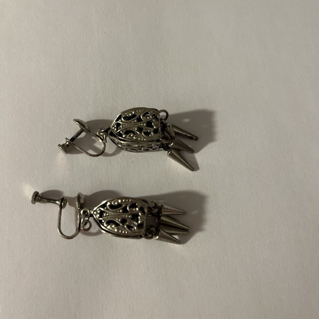 Silver Tone Earrings With Filigree Design And Dangling Spike