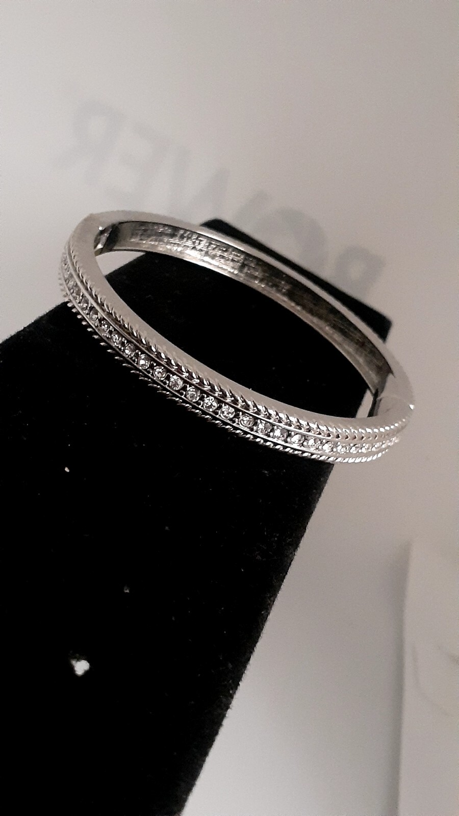 Cubic Zirconia Silvertone Bangle Bracelet. Magnetic closure. Signed China