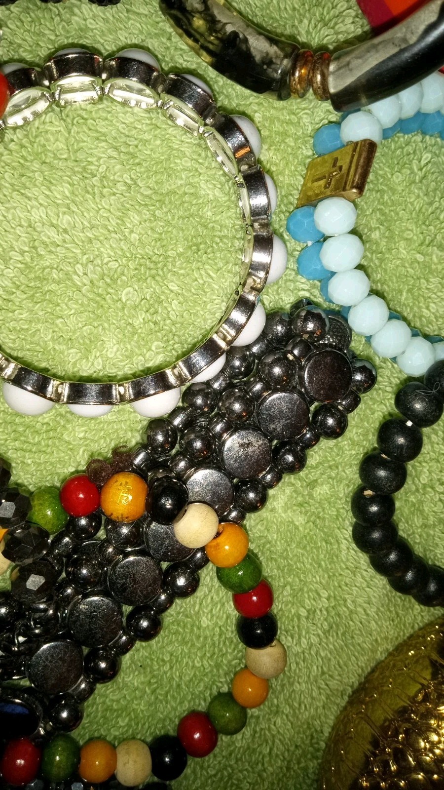 MULTIPLE FASHION BRACELETS MOST STRETCHY BUT SOME PRETTY ONES, SOME SIGNED BRASS