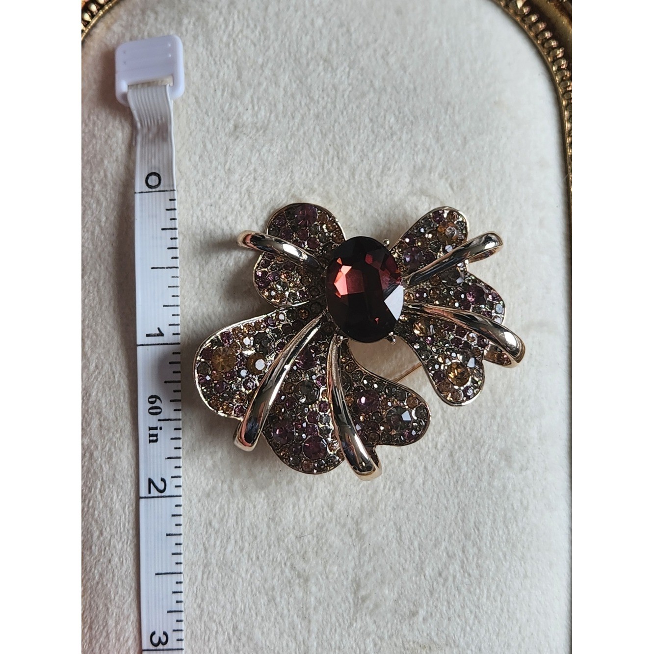 Gold-Tone Bow Brooch with Garnet-Center and Pink/Champagne Crystals