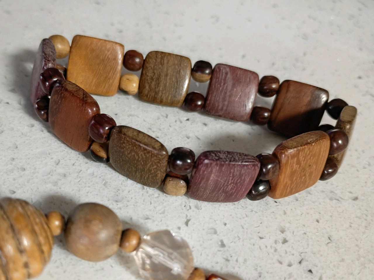 Brown wooden disc beaded necklace with lightweight wooden bracelet.