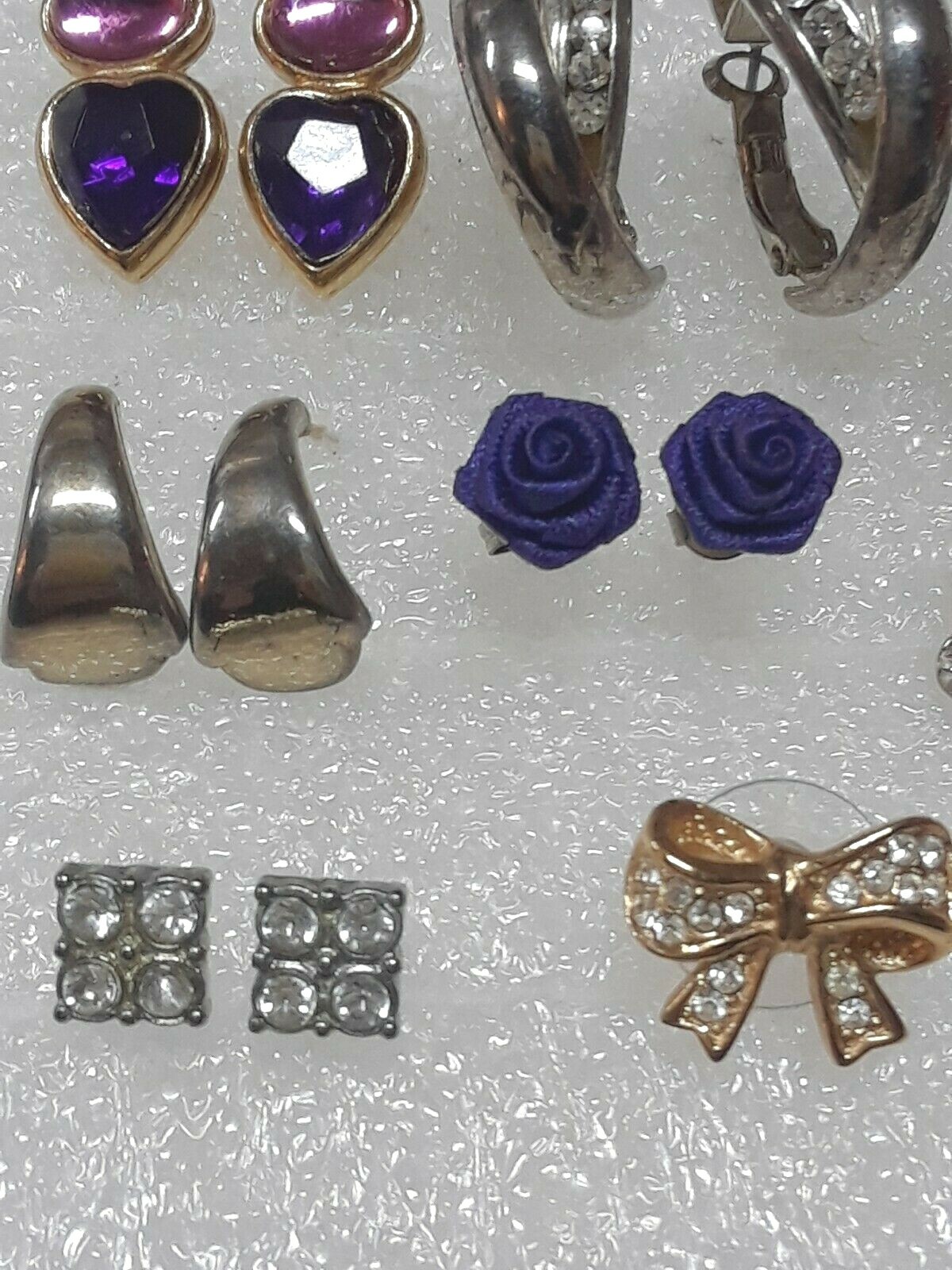 Pierced earrings with stones. pink, purple, clear. gold tone silver tone. 8 pair