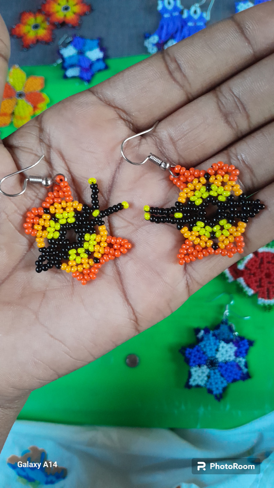 42 BEADED HANDMADE BRACELETS AND 28 PAIRS OF BEADED HANDMADE EARRINGS(LOT OF 70)