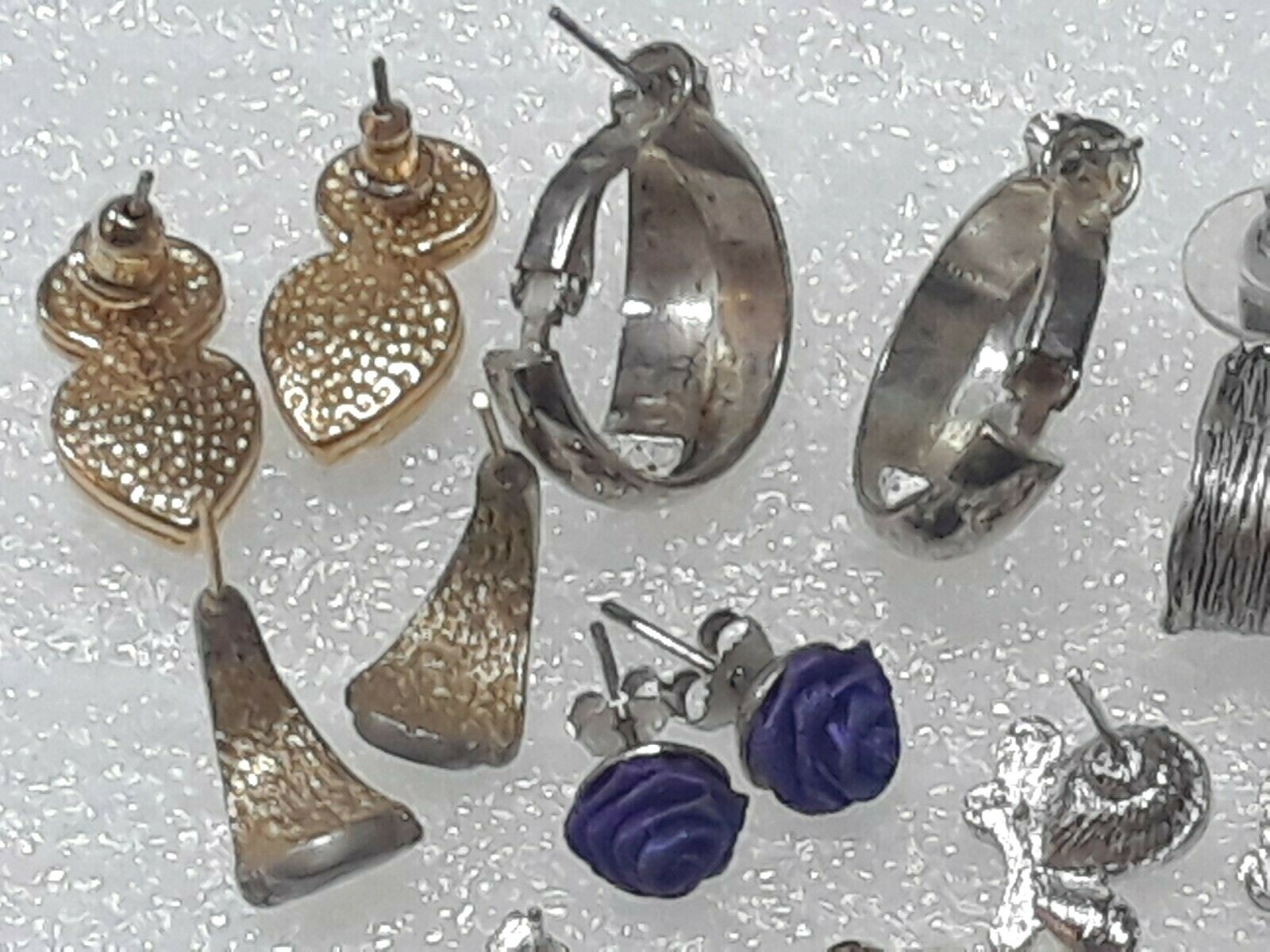 Pierced earrings with stones. pink, purple, clear. gold tone silver tone. 8 pair