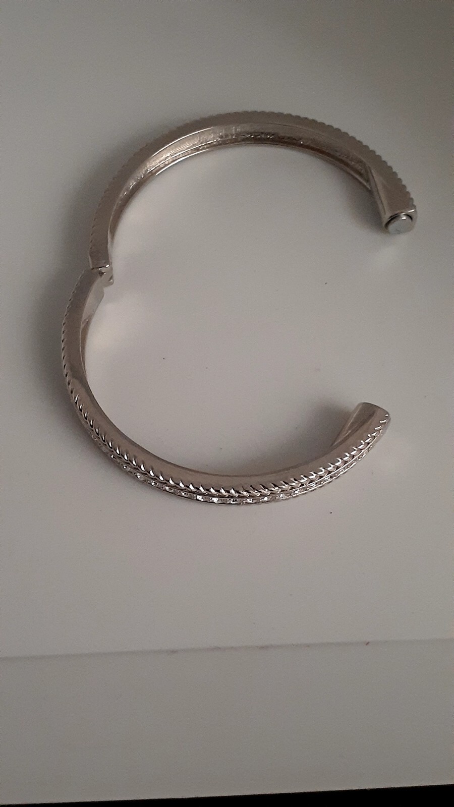 Cubic Zirconia Silvertone Bangle Bracelet. Magnetic closure. Signed China