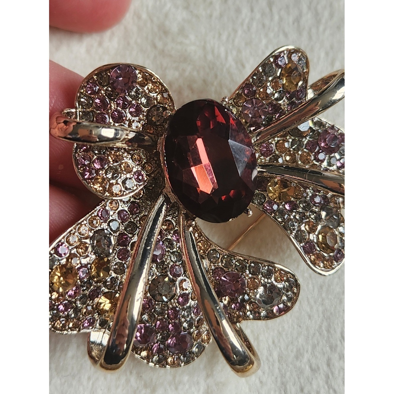Gold-Tone Bow Brooch with Garnet-Center and Pink/Champagne Crystals