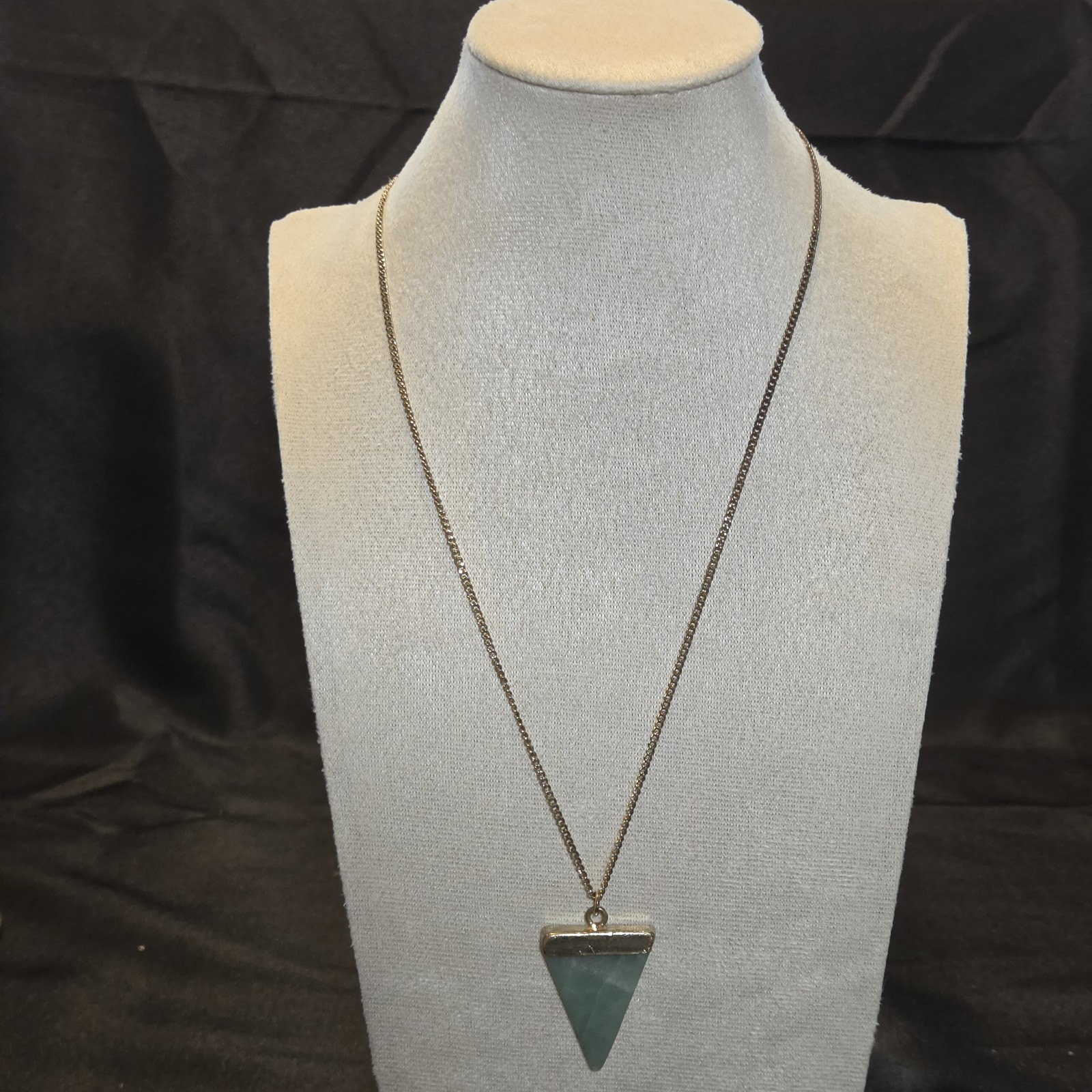 Gold-tone Chain With A Green Triangle Gemstone Pendant, Sleek And Elegant.