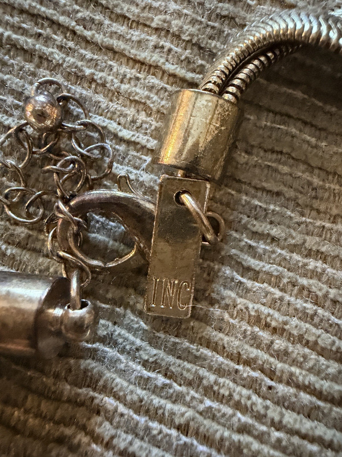 Gold-toned Express lariat necklace snake chain design with a knot