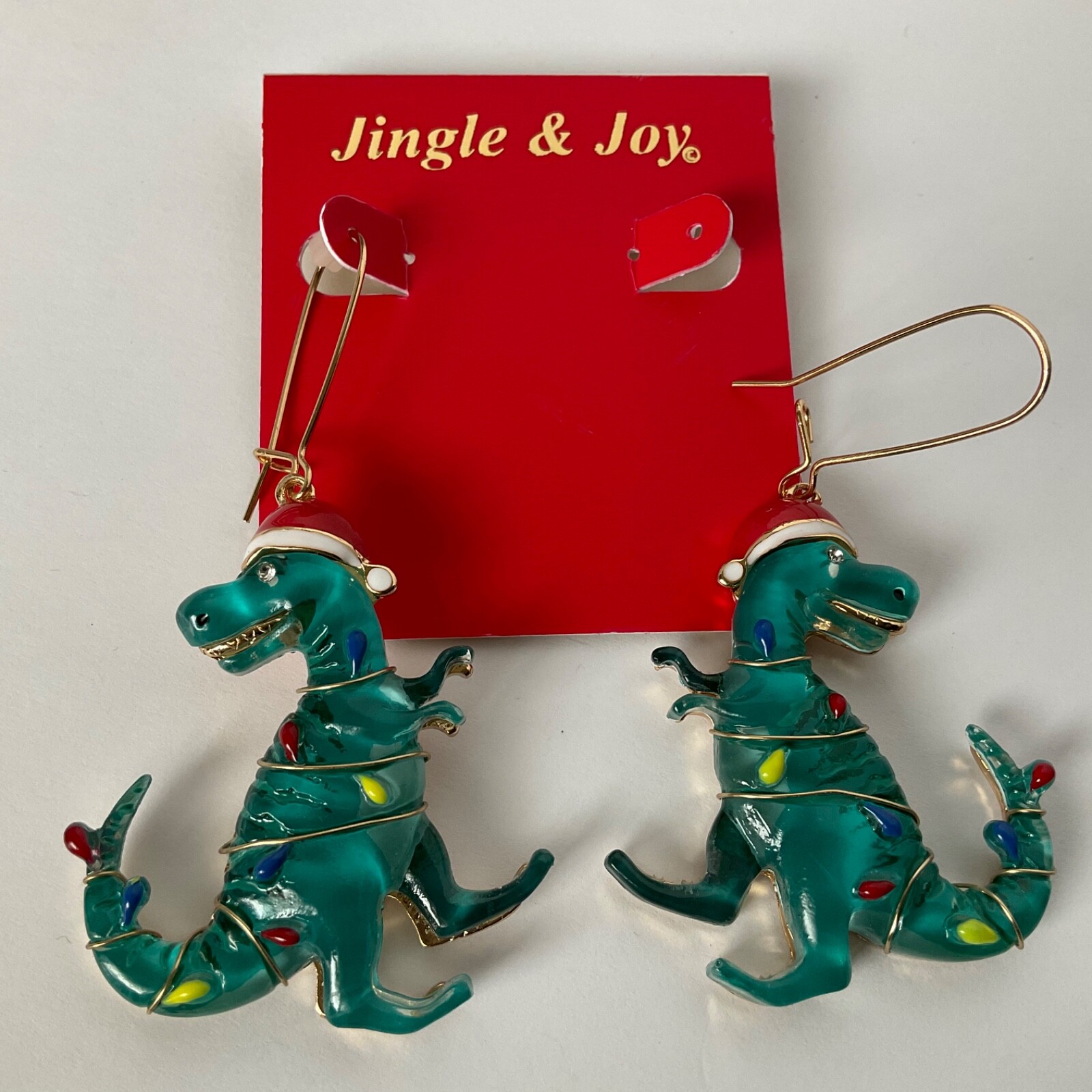 T-Rex Christmas Dinosaur Earrings Wearing Christmas Lights & Santa Hat