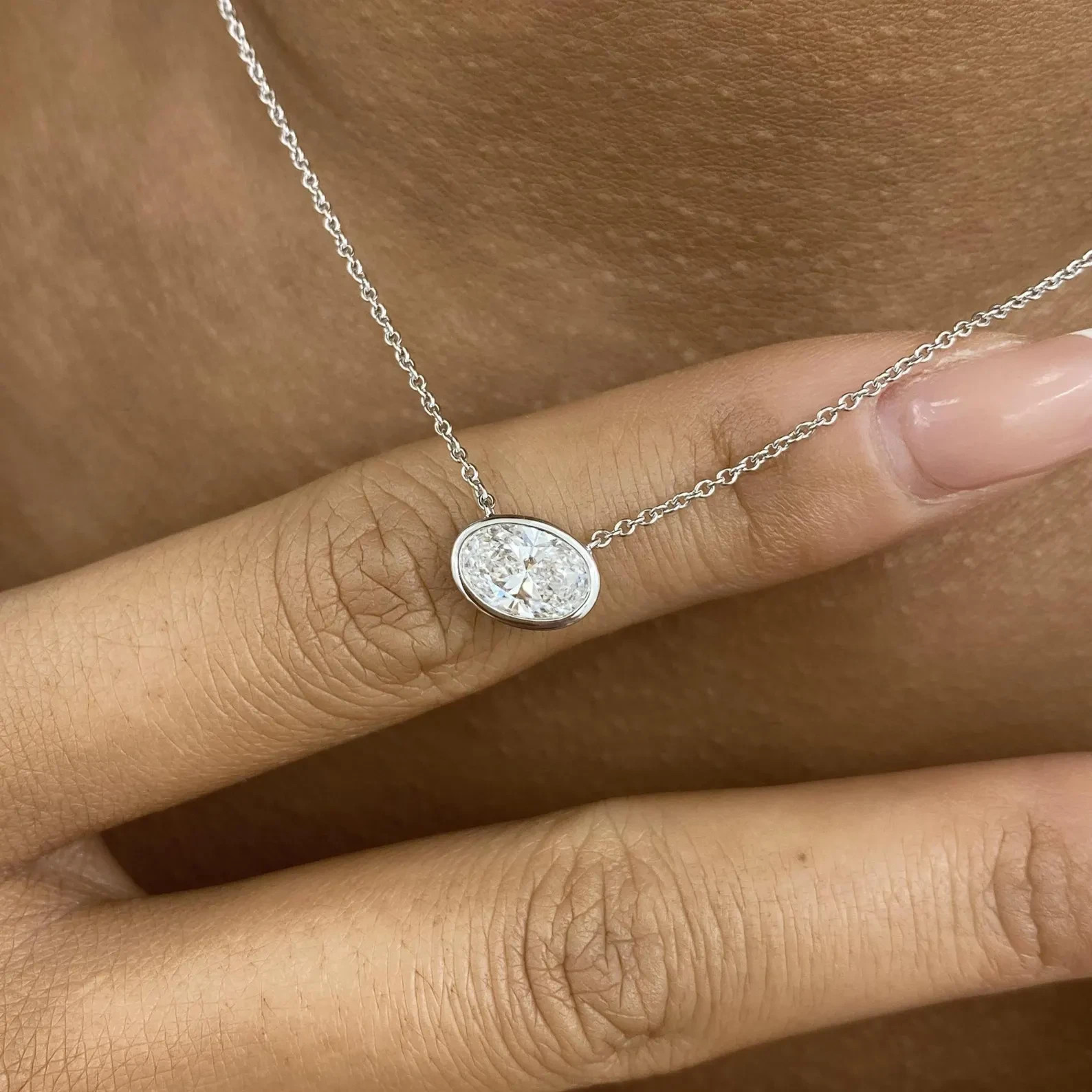 1.00 Ct Oval EF VS Lab Grown Diamond Bezel Solitaire Necklace in 14K White Gold