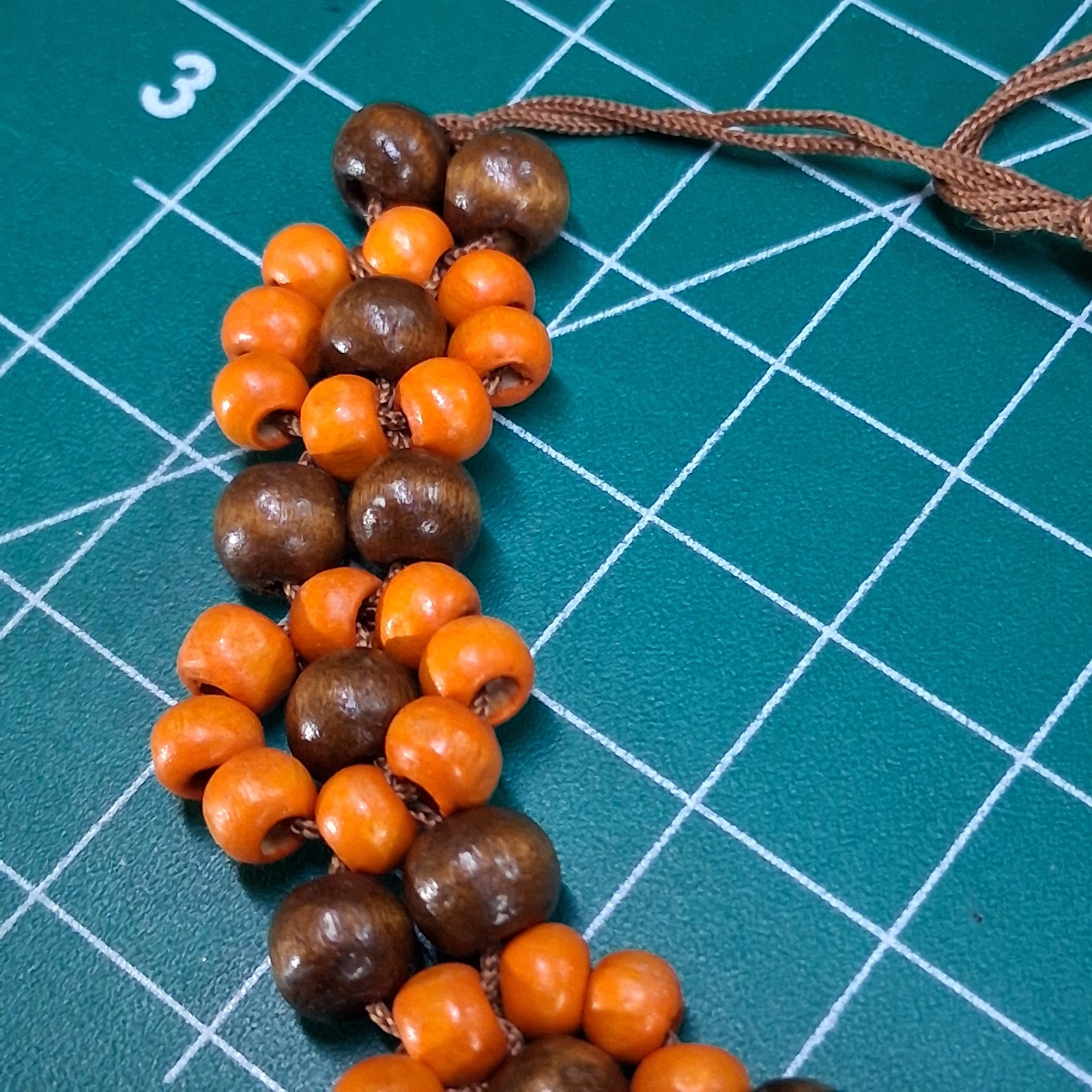 Orange & Natural Wood Channel Set Bead Adjustable Size Brown Cord Bracelet