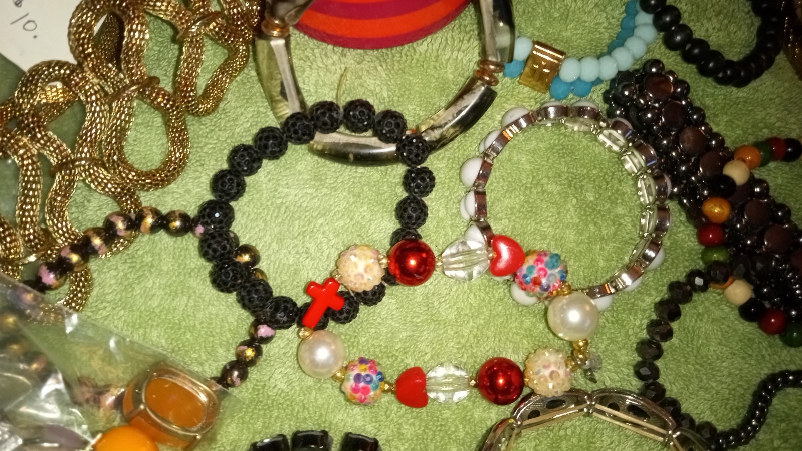 MULTIPLE FASHION BRACELETS MOST STRETCHY BUT SOME PRETTY ONES, SOME SIGNED BRASS