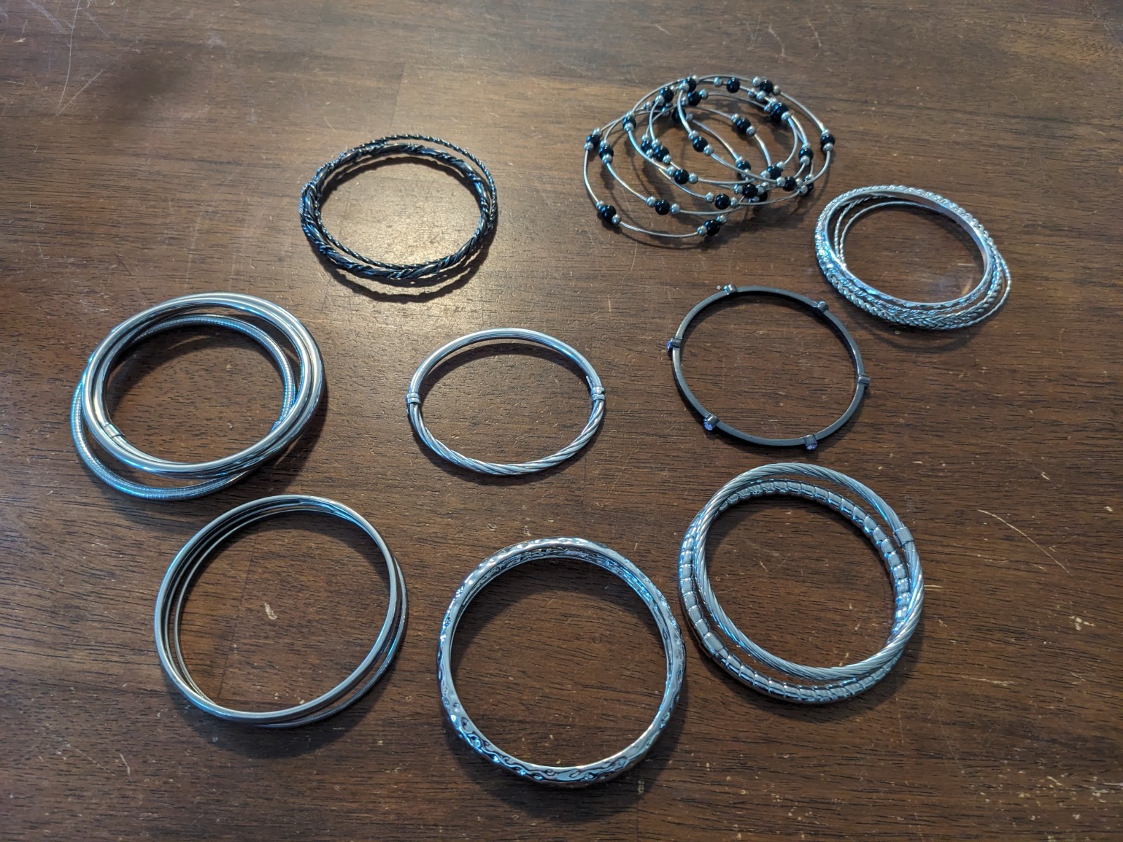 Lot of 24 Women’s Silver Tone, black metal & plastic Bracelets Variety