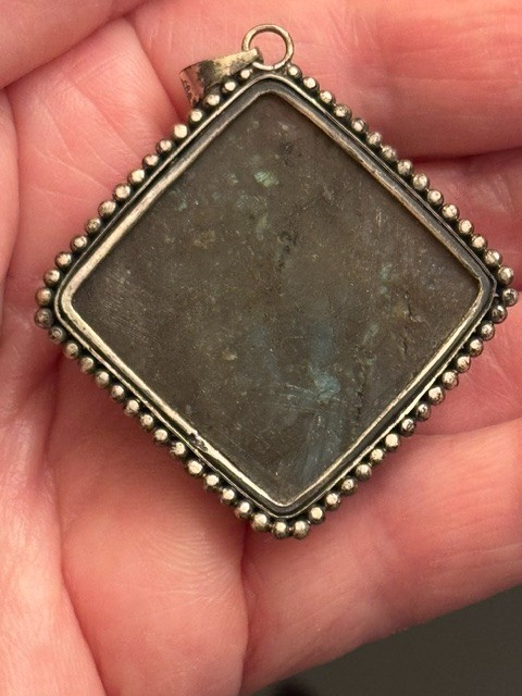 Square-cut natural labradorite pendant set in a textured silver frame. Vintage.