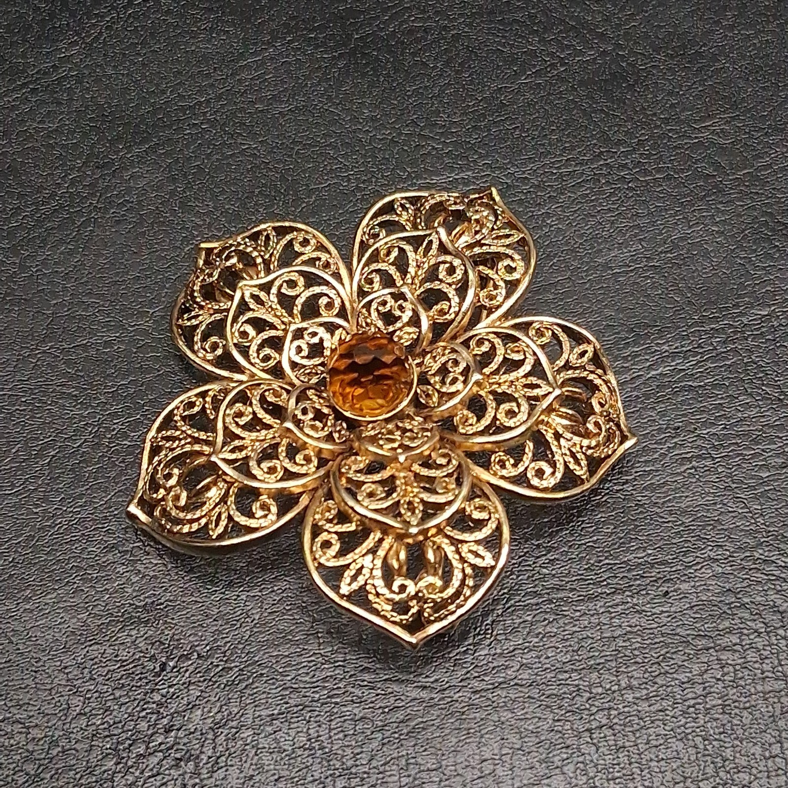 Signed MONET Gold Tone Filigree Flower Beooch Whit Brown Glass Center. 17.939