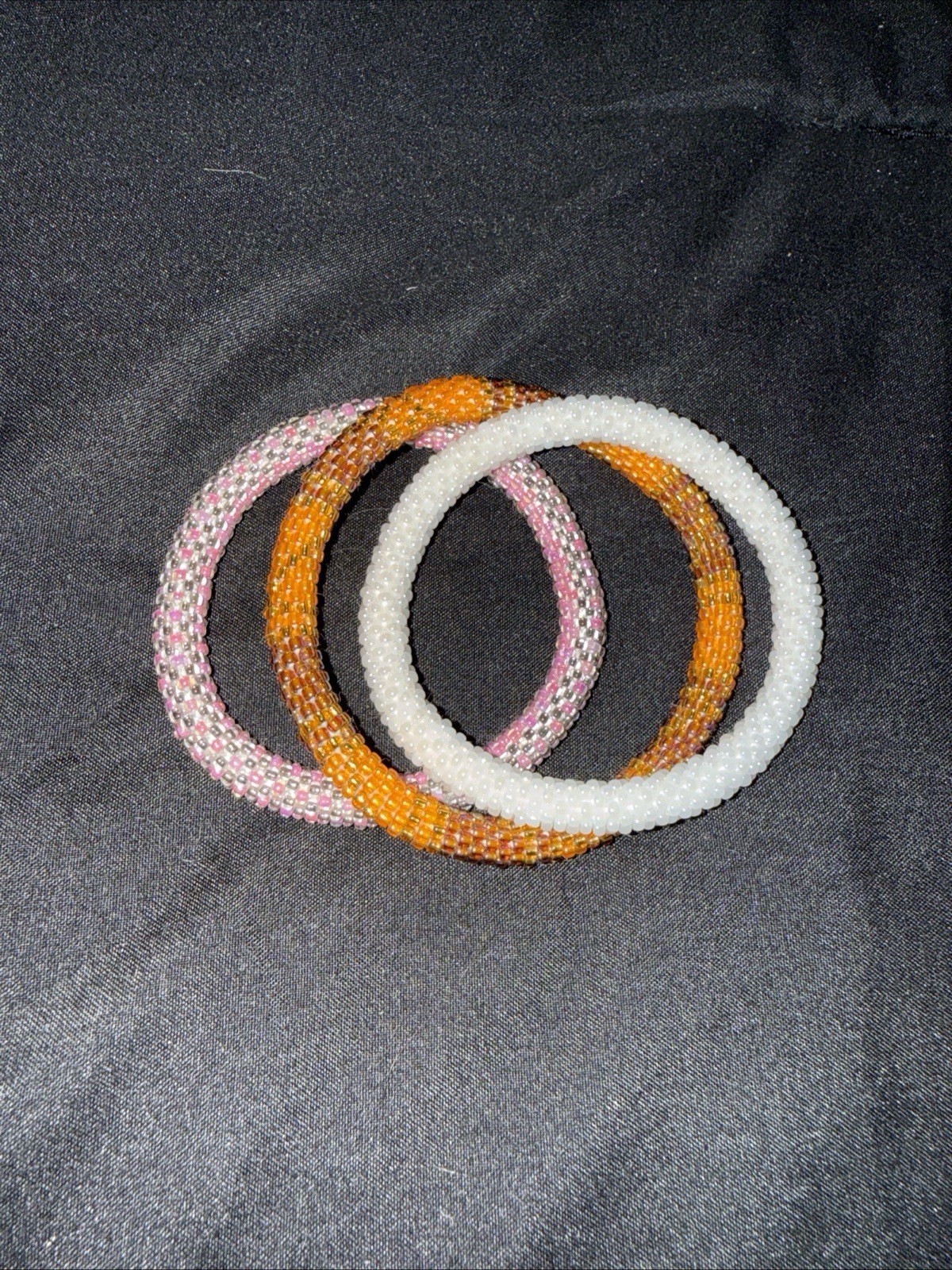Sashka Co Three Bracelet Lot Mixed Designs. Pink/white 7in Orange 8in Roll On