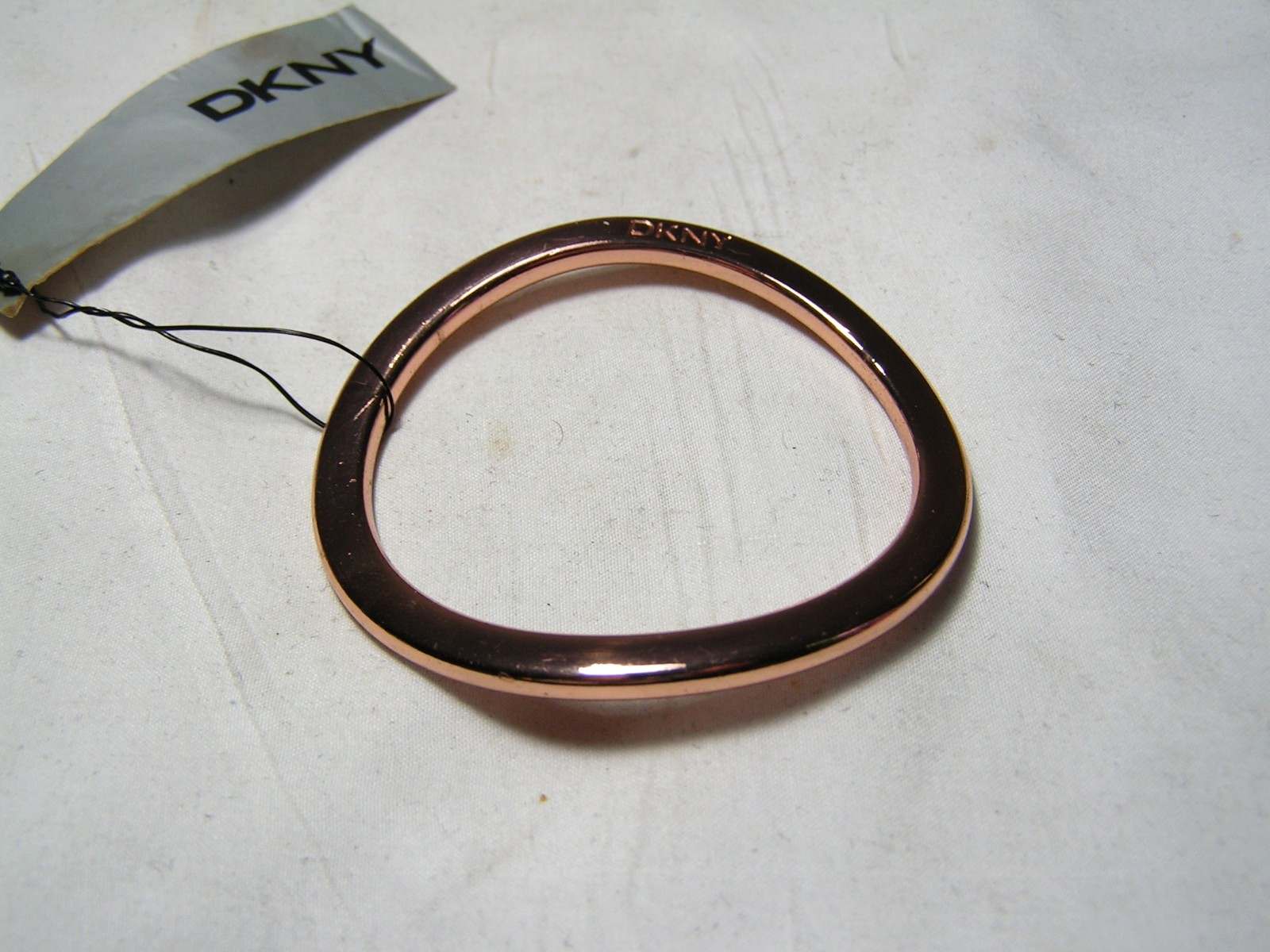 …DKNY Donna Karan…Rose Gold Tone Wavy Design Bangle Bracelet…Small Size…