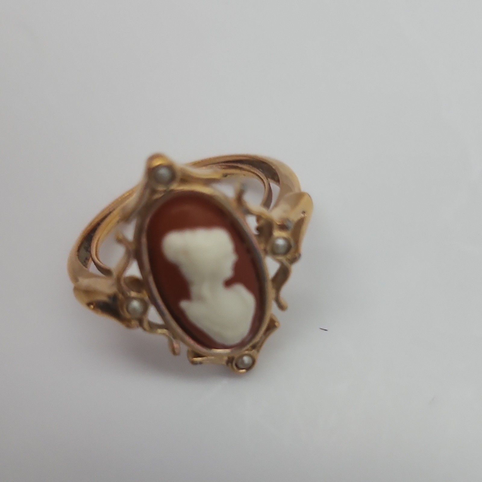 Avon Gold Tone Oval Cameo Ring Red/White Bezel Set Signed Adjustable Sz 8