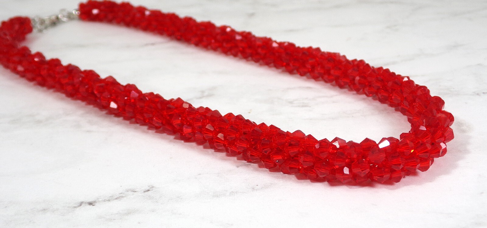Red glass beaded necklace in a sparkling thick cluster beaded rope design New