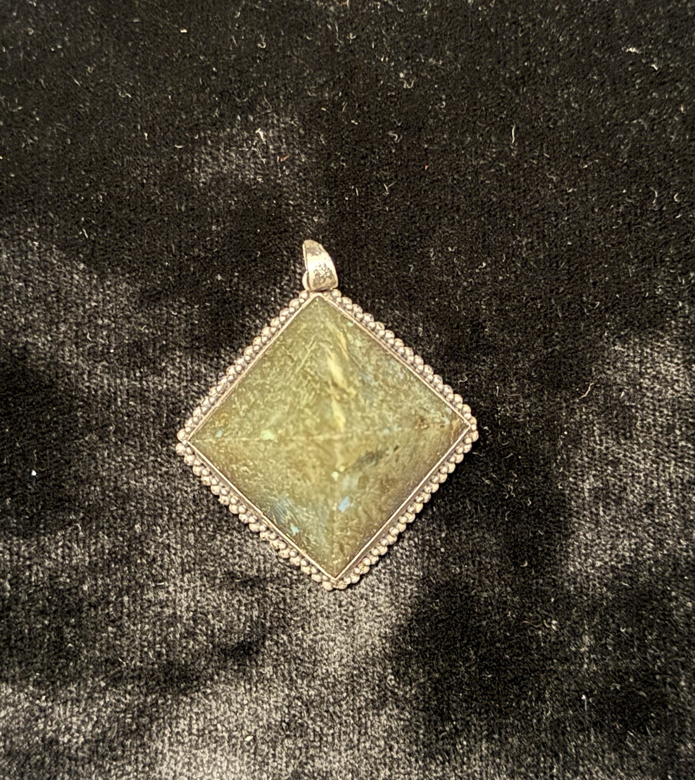 Square-cut natural labradorite pendant set in a textured silver frame. Vintage.