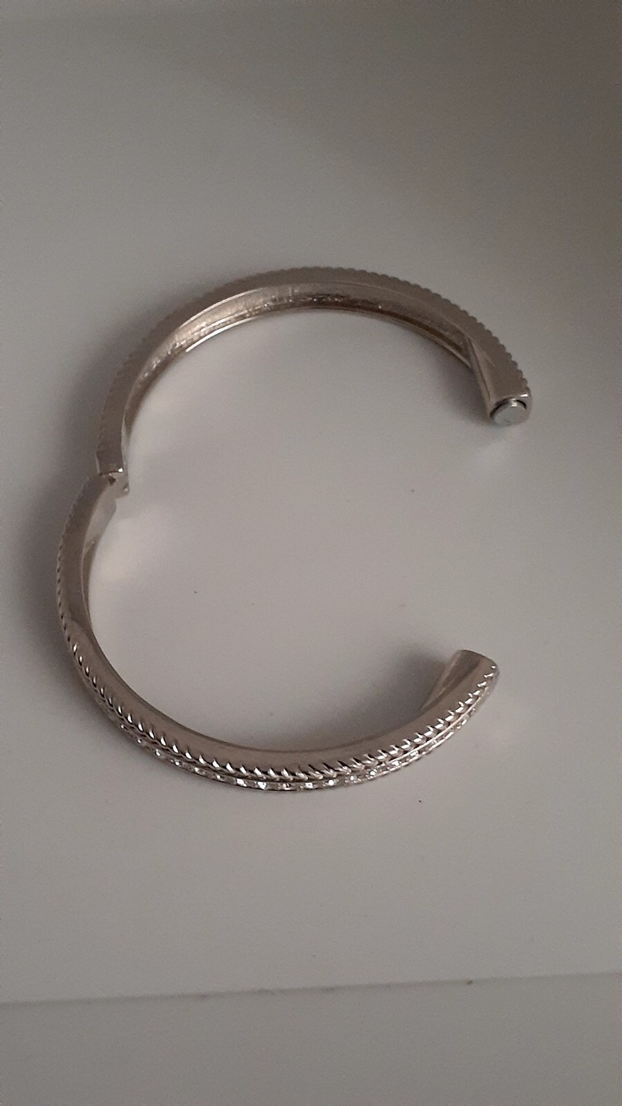 Cubic Zirconia Silvertone Bangle Bracelet. Magnetic closure. Signed China