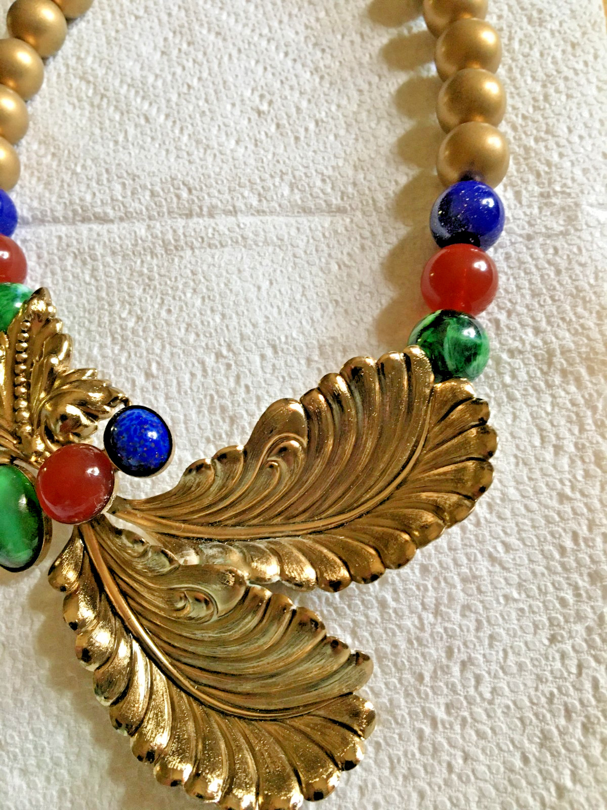 Ornate 18″ Necklace Golden + Stamped Metal Feathers? + Drilled Glass Beads