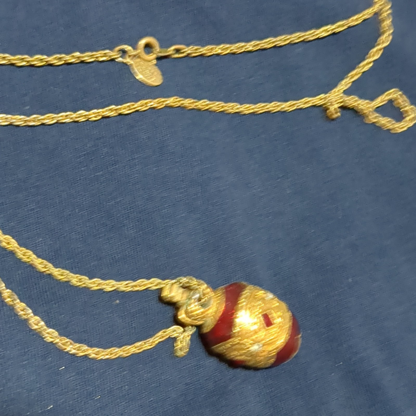 Gold Tone Metal Rope Chain Necklace with Red Egg-Shaped Pendant