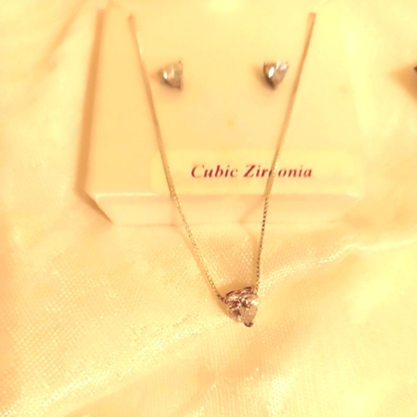 Cubic zirconia heart shaped sterling silver necklace and earrings set