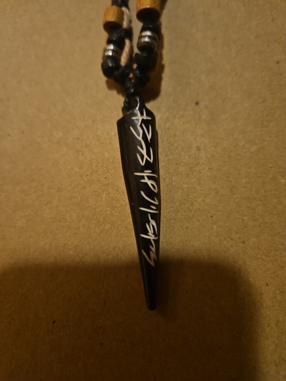 Rope Necklace With Cool Pendant With Unknown Design!