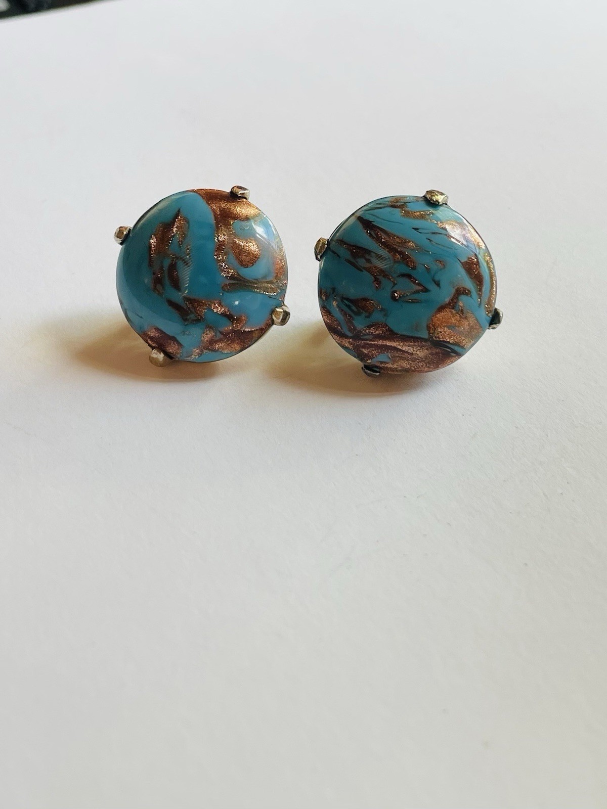 Vintage Crown Trifari round clip-on earrings, featuring turquoise cabochon