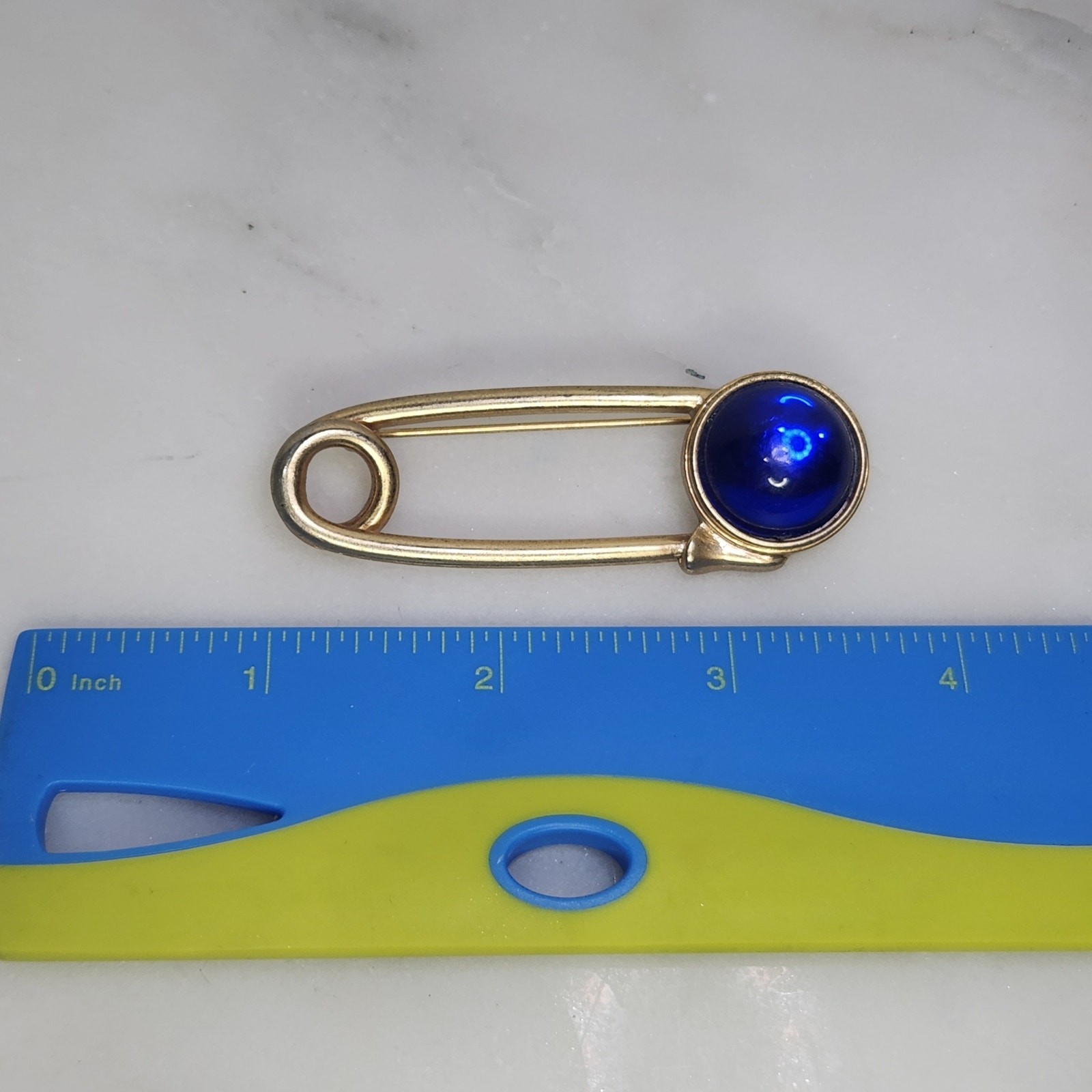 Vintage Swank Gold Tone Safety Pin Brooch Blue Cabochon Stone Lapel Pin MCM