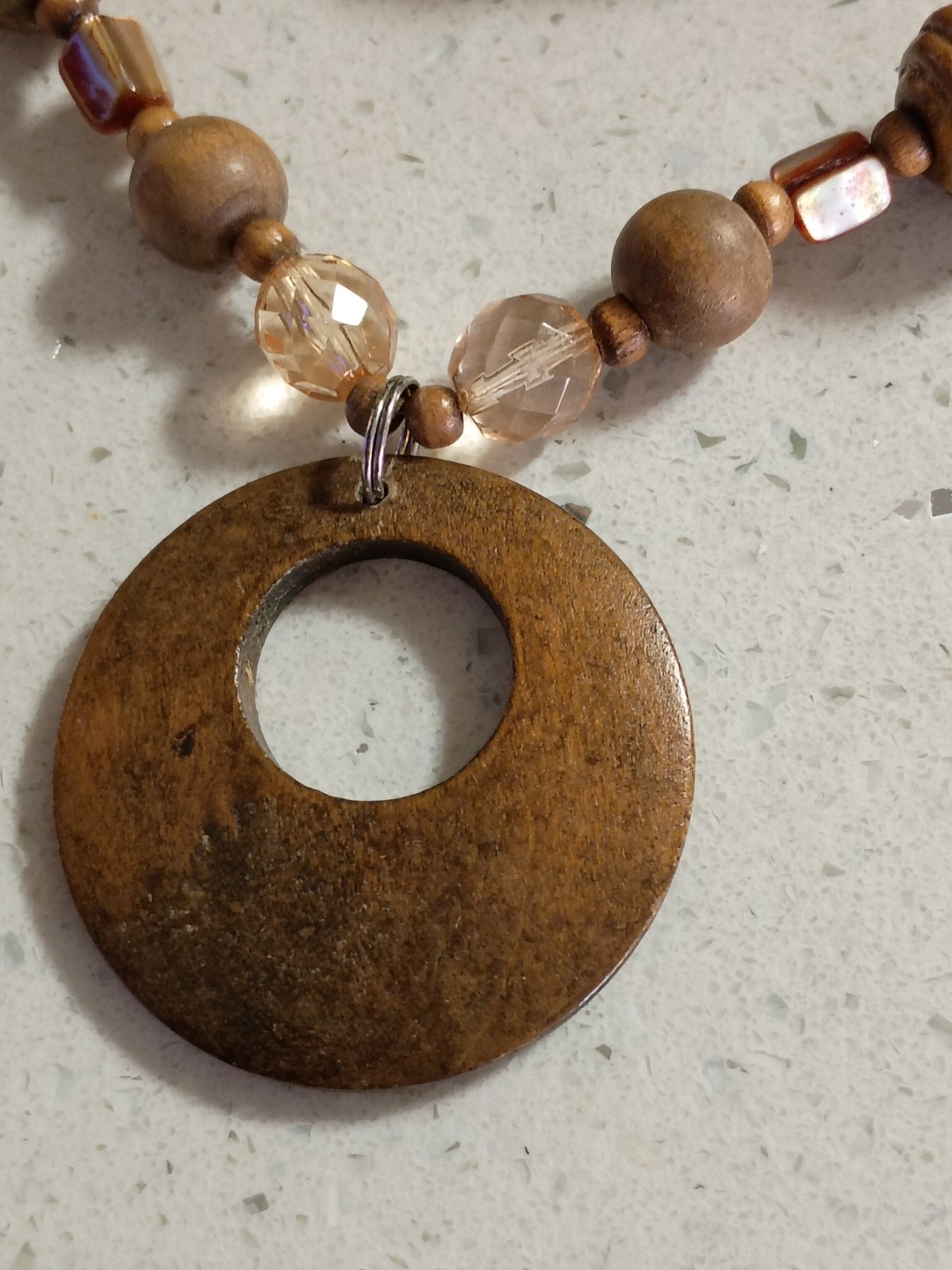 Brown wooden disc beaded necklace with lightweight wooden bracelet.