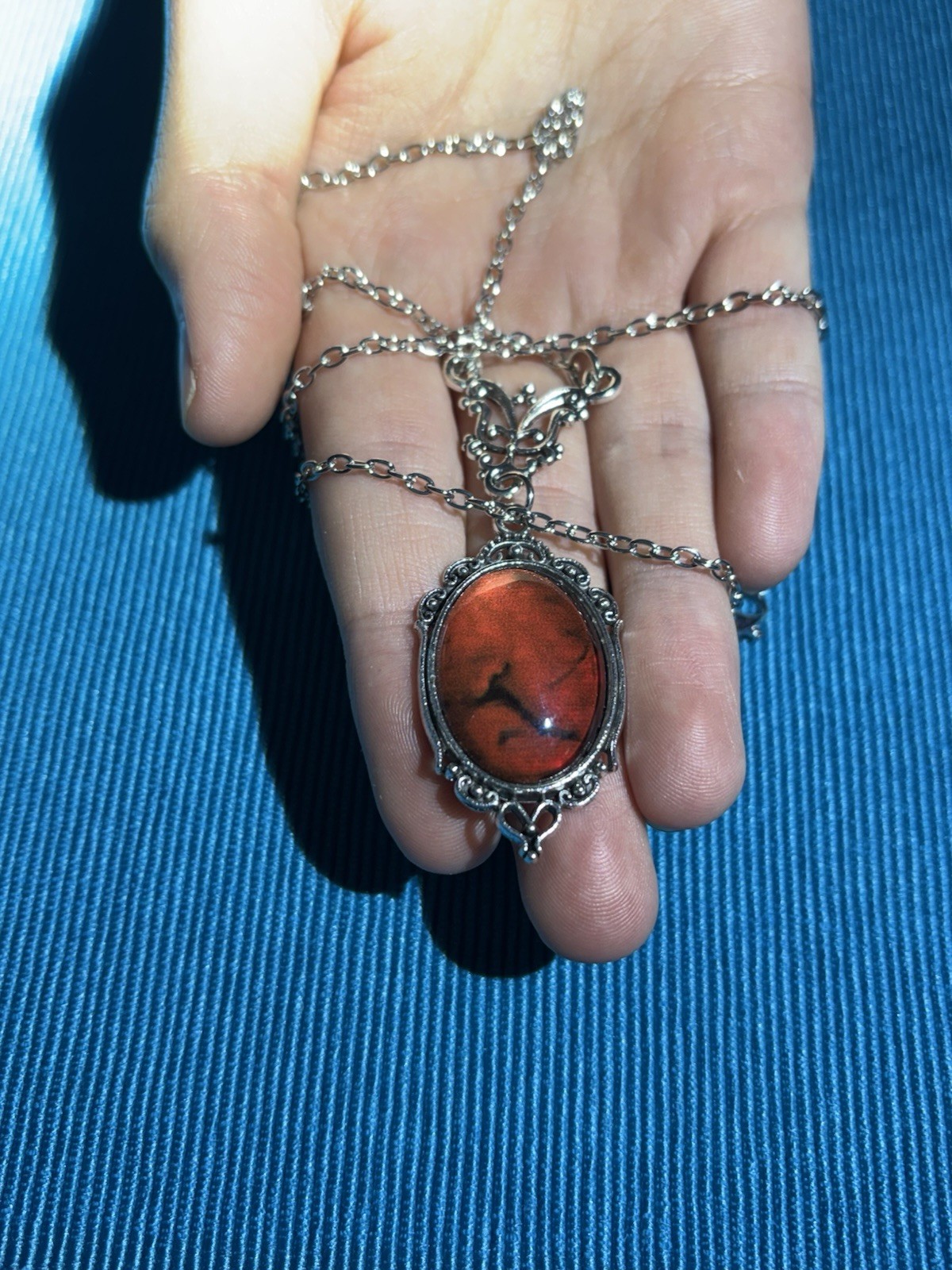 Blood red pendant silver tone chain necklace
