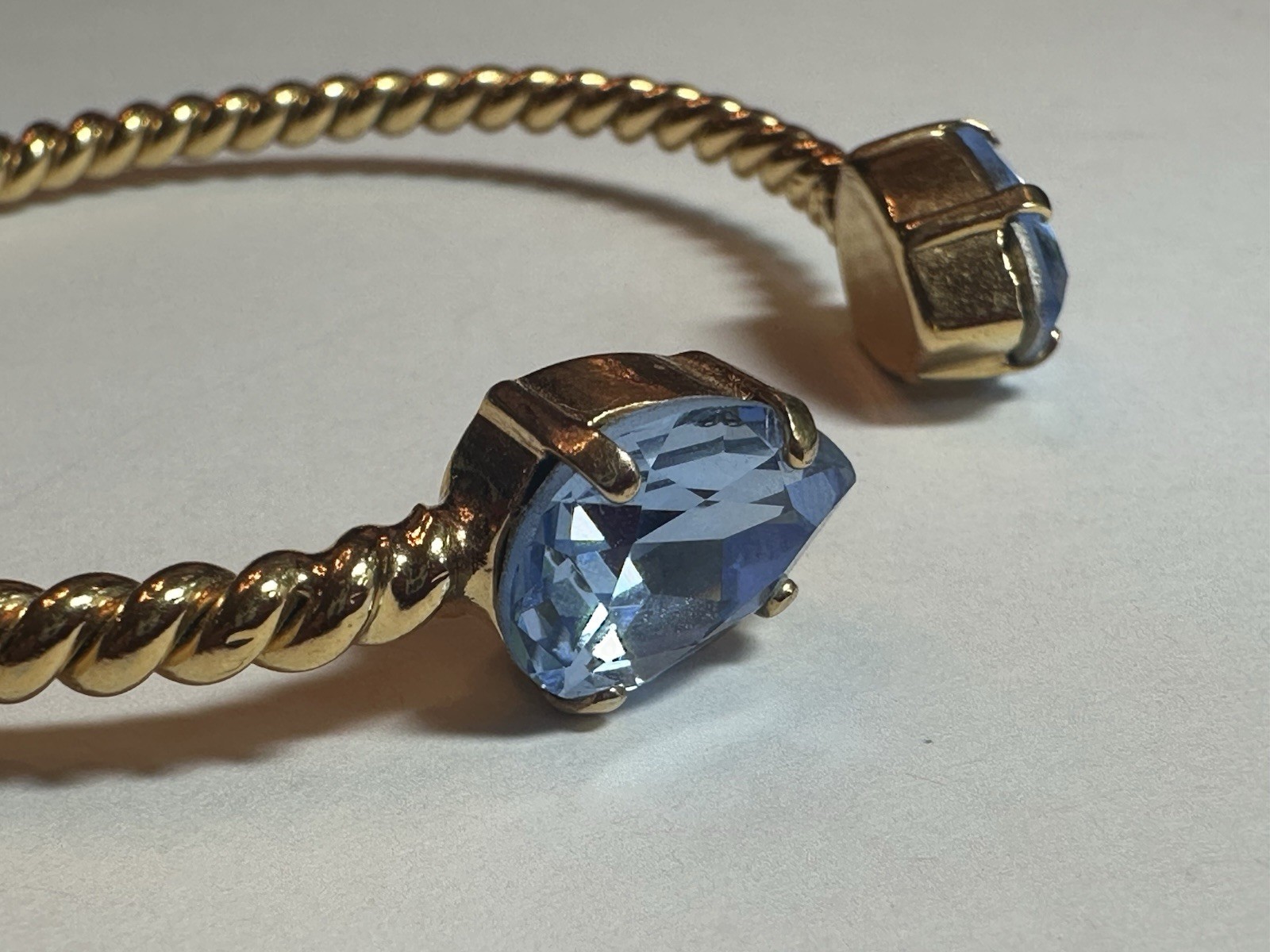 Caroline Svedbom Mini Drop Twisted Gold Tone Bracelet & Blue Swarovski Crystal