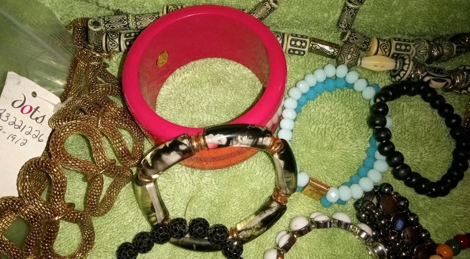 MULTIPLE FASHION BRACELETS MOST STRETCHY BUT SOME PRETTY ONES, SOME SIGNED BRASS