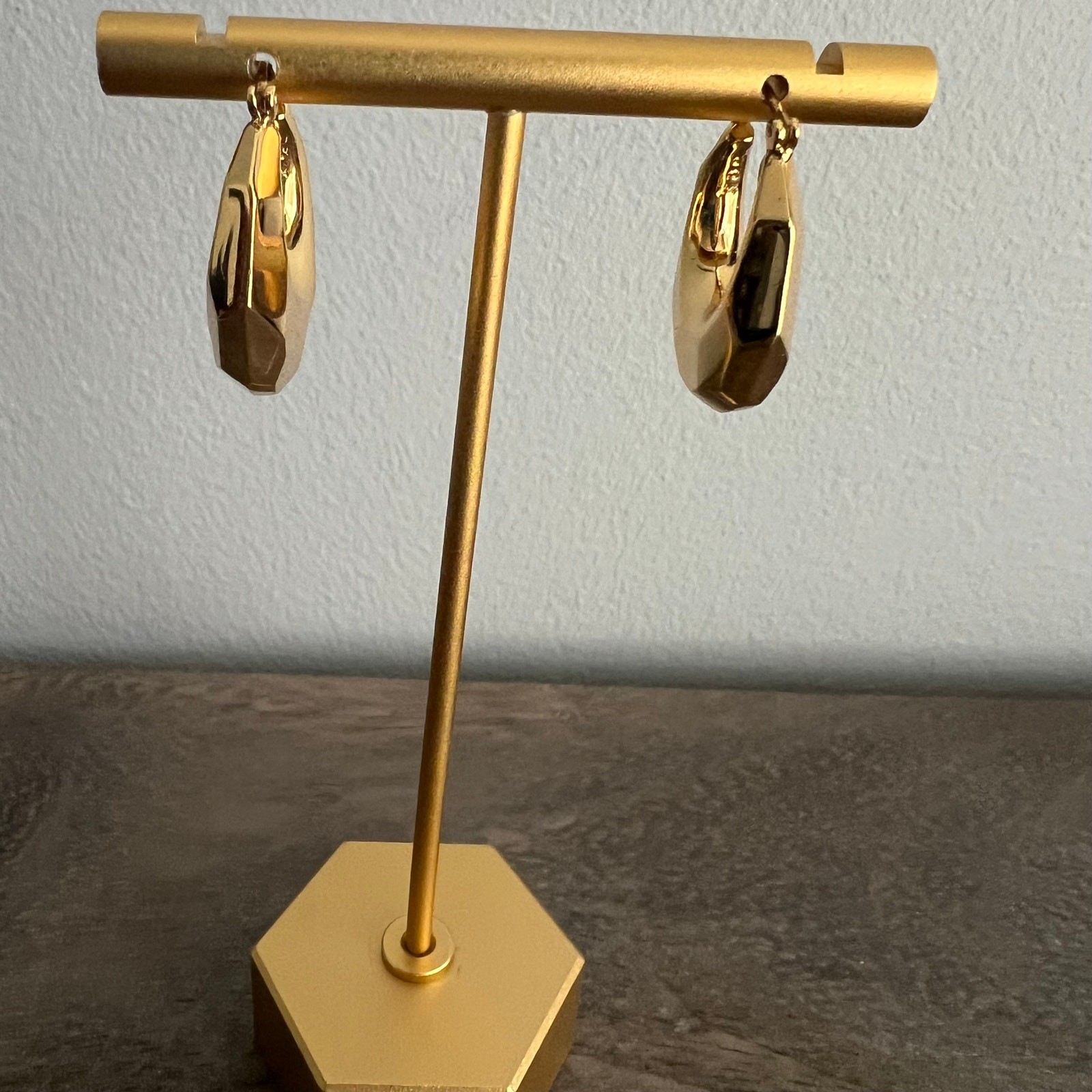 Kae by Karrueche signed gold tone chunky hoop earrings with branded pouch