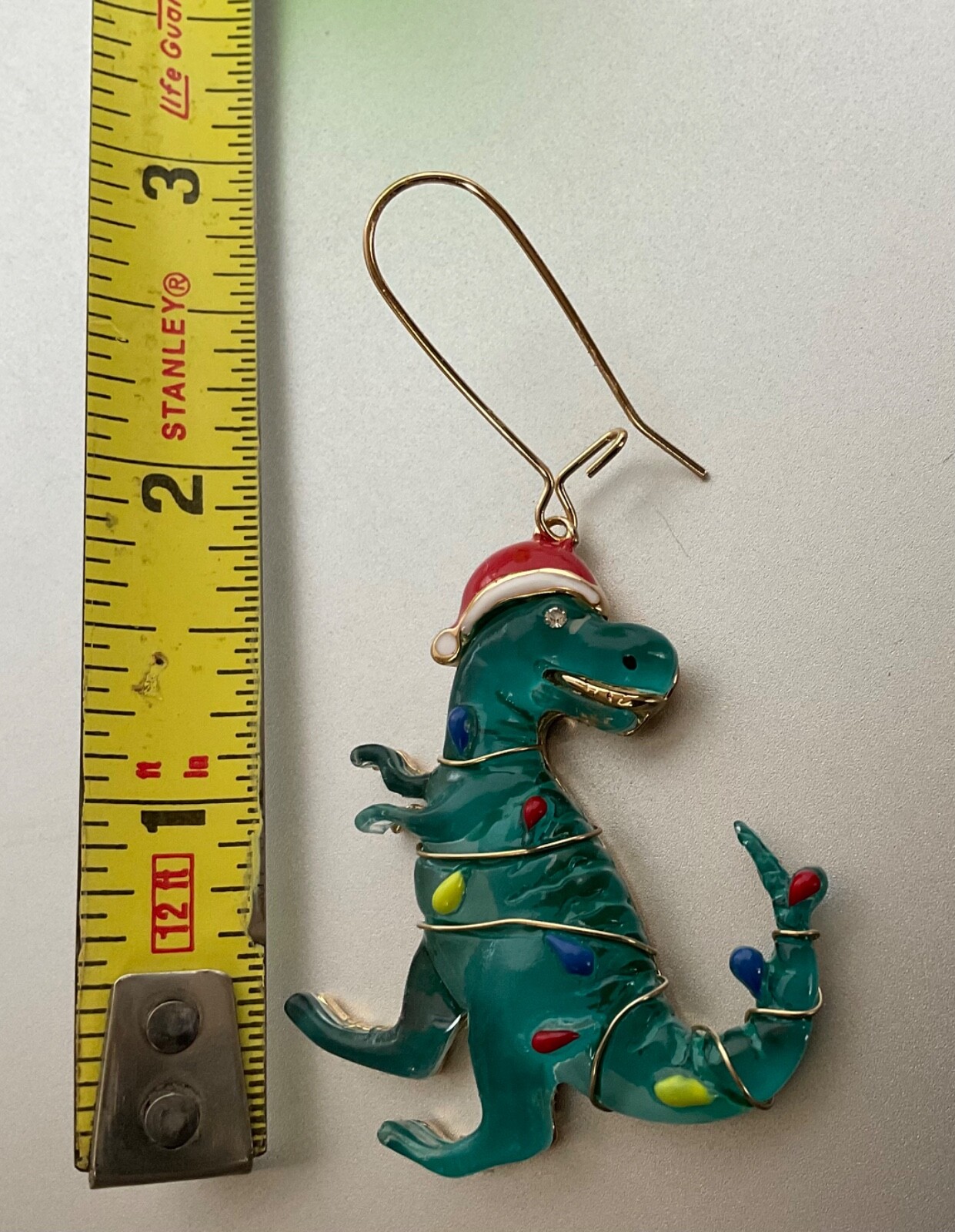 T-Rex Christmas Dinosaur Earrings Wearing Christmas Lights & Santa Hat