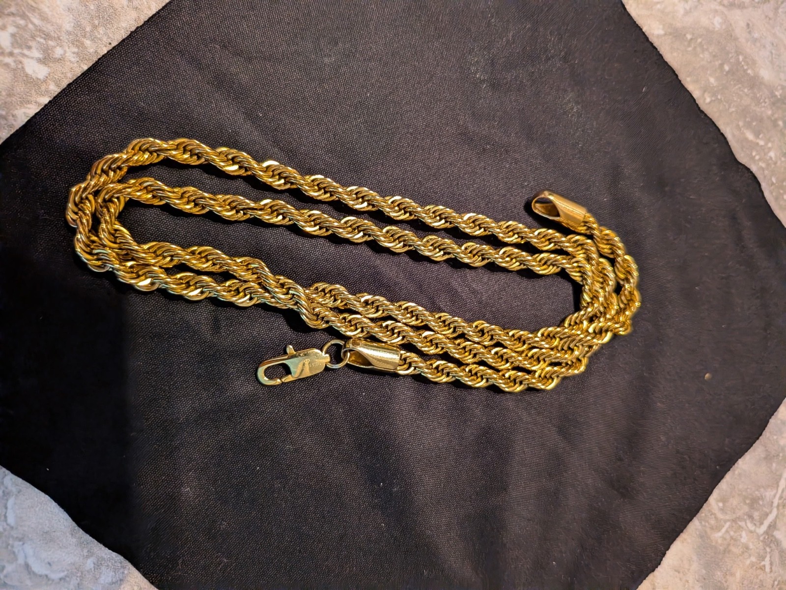 Gold Plated rope chain necklace features a sturdy lobster claw clasp, commo